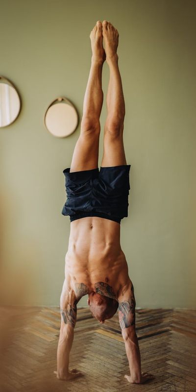 Athletic man doing core stabilization exercises in a loft.